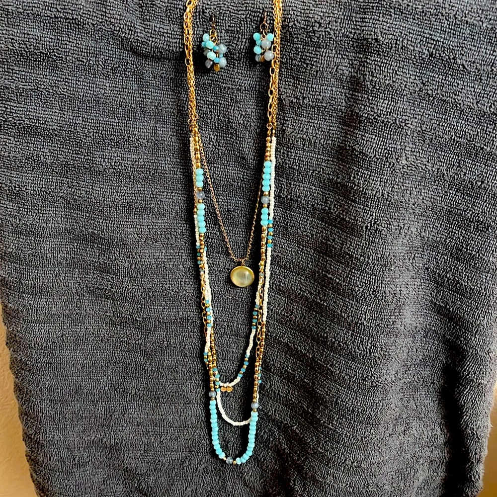 For layered white, baby blue and gold necklace with earrings